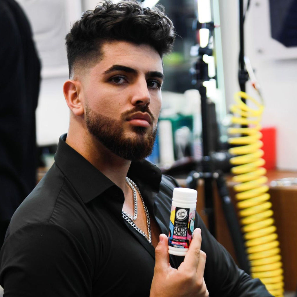 gonzalo model holding Rolda hair styling powder